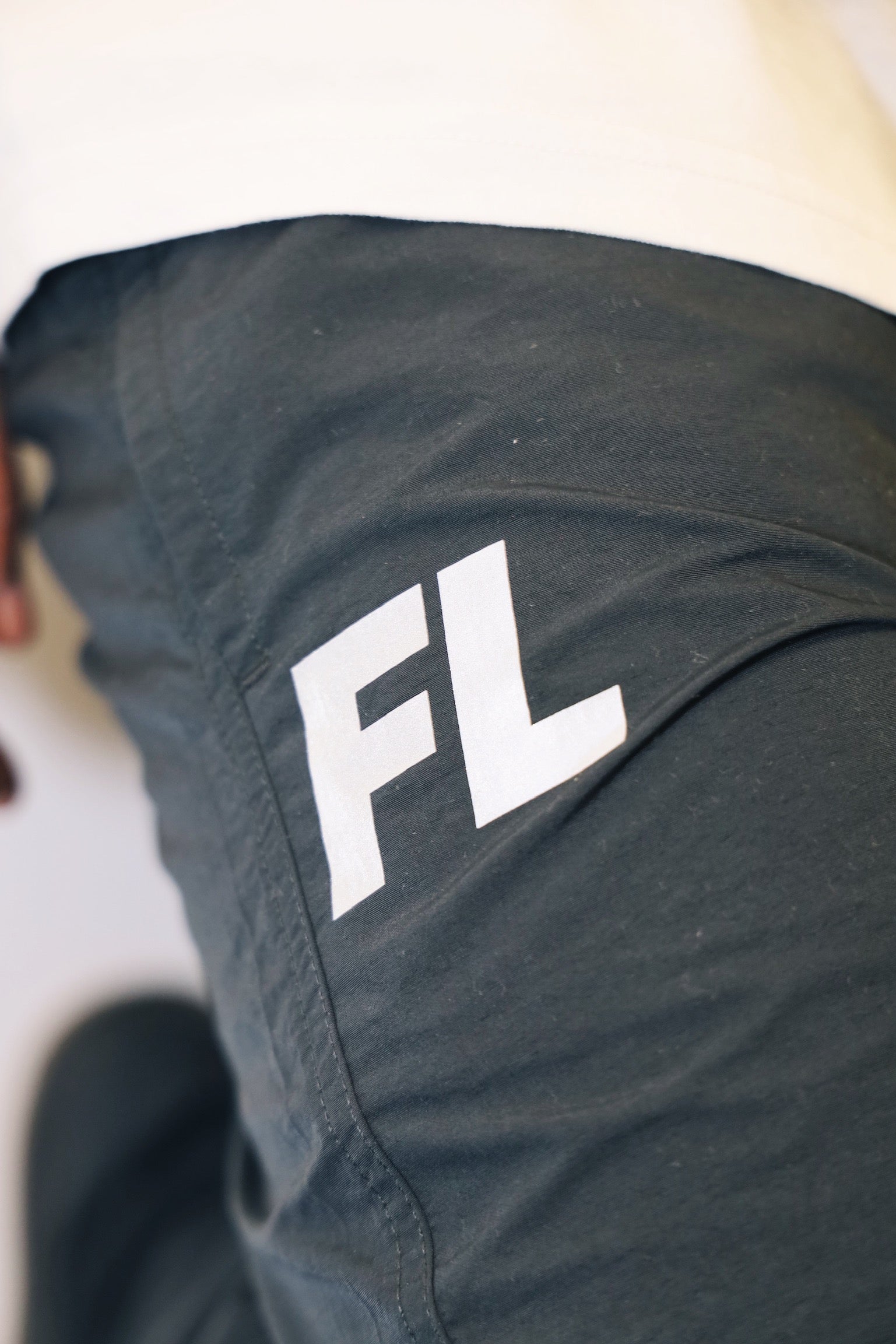 Shot of FL logo on FL Warm Up Pants.